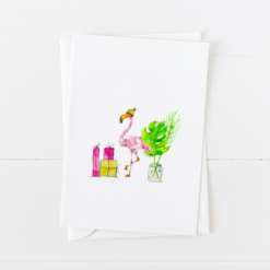 Cute pink flamingo doodle wearing a knit cap next to holiday gifts, pointed flap envelope