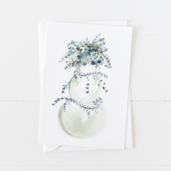 snowman Christmas card with ice blue and gray flowers as a hat, scarf, and arms with pointed flap envelope